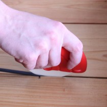 Draughtex being fitted into a flooerboard gap using the applicator