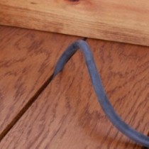 DraughtEx fitted into a dark wooden floor