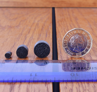 the 3 sizes of DraughtEx next to a ruler an a 20p coin