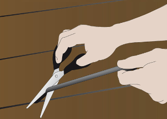 DraughtEx floor gap fixer being cut to size with household scissors