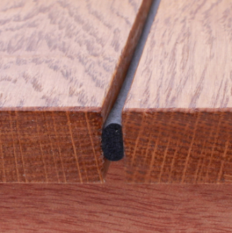 Draughtex fitted into a flooboard gap
